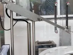 Unité de positionnement des bouchons